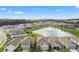 Aerial view of houses and a lake with a fountain at 3033 Timber Hawk Cir, Ocoee, FL 34761
