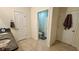 Clean bathroom with double vanity, toilet, and separate door at 3033 Timber Hawk Cir, Ocoee, FL 34761