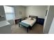 Charming bedroom with a full-size bed and built-in storage at 3033 Timber Hawk Cir, Ocoee, FL 34761