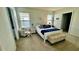 Spacious bedroom with a queen-size bed and an armchair at 3033 Timber Hawk Cir, Ocoee, FL 34761