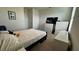 Cozy bedroom with a double bed and a large TV at 3033 Timber Hawk Cir, Ocoee, FL 34761