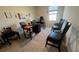 Home office space with a desk, chairs, and ample natural light at 3033 Timber Hawk Cir, Ocoee, FL 34761