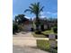Single-story house with a palm tree and driveway at 310 Blue Jacket Ln, Orlando, FL 32825