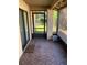 Cozy screened porch with tiled floor at 310 Blue Jacket Ln, Orlando, FL 32825