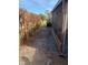 Side yard with a path and shrubs at 310 Blue Jacket Ln, Orlando, FL 32825