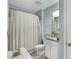 Bathroom with shower/tub combo and granite vanity at 351 Lazio Cir, Debary, FL 32713