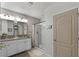 Bathroom boasts a double vanity and a shower at 351 Lazio Cir, Debary, FL 32713