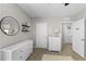 Spacious bedroom with dresser and access to hallway at 351 Lazio Cir, Debary, FL 32713