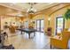 Inviting community clubhouse featuring a billiard table, comfortable seating, and elegant lighting fixtures at 351 Lazio Cir, Debary, FL 32713