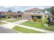 Charming two-story home with a well-manicured lawn, attached garage, and inviting curb appeal at 351 Lazio Cir, Debary, FL 32713