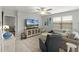Bright living room features comfortable seating and a large TV at 351 Lazio Cir, Debary, FL 32713