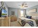 Main bedroom with king-size bed and large TV at 351 Lazio Cir, Debary, FL 32713