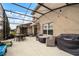 Covered patio with seating area and grill at 351 Lazio Cir, Debary, FL 32713