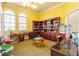 Bright playroom with built-in bookshelves, toys, and a cozy atmosphere for children to enjoy at 351 Lazio Cir, Debary, FL 32713