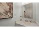 Small powder room with vanity and decorative mirror at 351 Lazio Cir, Debary, FL 32713