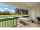 Outdoor balcony space with seating and a view of the golf course at 488 W Par St # 4, Orlando, FL 32804