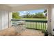 Enjoy golf course views from this relaxing balcony, complete with small table and chairs at 488 W Par St # 4, Orlando, FL 32804