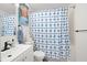 Clean bathroom with white vanity and a patterned shower curtain at 488 W Par St # 4, Orlando, FL 32804
