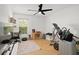 Well-lit bedroom with hardwood floors and a ceiling fan at 488 W Par St # 4, Orlando, FL 32804
