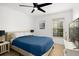 Comfortable bedroom with a ceiling fan and blue bedding at 488 W Par St # 4, Orlando, FL 32804