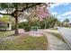 The Greens Condominiums entrance, with a tree in bloom at 488 W Par St # 4, Orlando, FL 32804