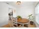 Dining area with wooden table and white chairs at 488 W Par St # 4, Orlando, FL 32804