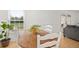 Dining area with wooden table and white chairs, view to living room at 488 W Par St # 4, Orlando, FL 32804
