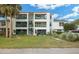Two-story building with green accents and balconies. Lush landscaping surrounds the building at 488 W Par St # 4, Orlando, FL 32804