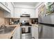 Bright kitchen with stainless steel appliances and white cabinetry at 488 W Par St # 4, Orlando, FL 32804