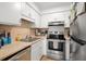 Updated kitchen featuring stainless steel appliances and light countertops at 488 W Par St # 4, Orlando, FL 32804