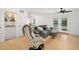 Living room with gray sofa, built-in bar, and access to balcony at 488 W Par St # 4, Orlando, FL 32804