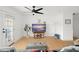 Living room with gray sofa and hardwood floors, view to balcony at 488 W Par St # 4, Orlando, FL 32804