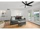Living room with gray sofa and access to balcony at 488 W Par St # 4, Orlando, FL 32804