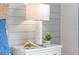White nightstand with lamp, book, and glasses at 5068 Tana Ter, St Cloud, FL 34772