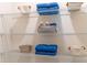 Linen closet with shelves, baskets, and blue towels at 5071 Tana Ter, St Cloud, FL 34772