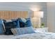 Main bedroom with blue and tan bedding and a unique headboard at 5072 Tana Ter, St Cloud, FL 34772