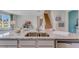 Kitchen island with granite countertops and double sink, overlooking living area at 5076 Tana Ter, St Cloud, FL 34772