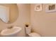 Small bathroom with a pedestal sink and a toilet at 5080 Tana Ter, St Cloud, FL 34772