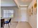 Bright entryway with a white door, tile flooring and neutral walls at 5080 Tana Ter, St Cloud, FL 34772