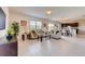 Open concept living room with tile flooring, neutral walls, and access to the kitchen at 5080 Tana Ter, St Cloud, FL 34772