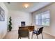 Home office with a large desk and two chairs at 5080 Tana Ter, St Cloud, FL 34772