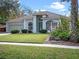 Single-story house with a driveway and nicely landscaped yard at 5085 Blacknell Ln, Sanford, FL 32771