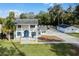 Aerial view of a charming house with a pool and detached garage at 5703 Se 109Th St, Belleview, FL 34420