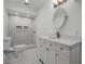 Modern bathroom with white vanity and a walk-in shower at 5703 Se 109Th St, Belleview, FL 34420