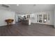 Open kitchen with island and French doors leading outdoors at 5703 Se 109Th St, Belleview, FL 34420