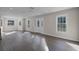 Sun-drenched living area with wood floors and bay window at 5703 Se 109Th St, Belleview, FL 34420