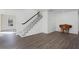 Elegant staircase with white railing and wood flooring at 5703 Se 109Th St, Belleview, FL 34420