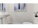 Simple and clean half bathroom with pedestal sink and toilet at 6587 Leo Ln, St Cloud, FL 34773