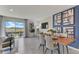 Bright dining area with wood table and access to a backyard at 6587 Leo Ln, St Cloud, FL 34773