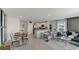 Open floor plan living room with modern furniture and kitchen views at 6587 Leo Ln, St Cloud, FL 34773